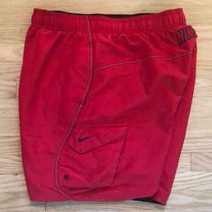 Red Nike swim trunks